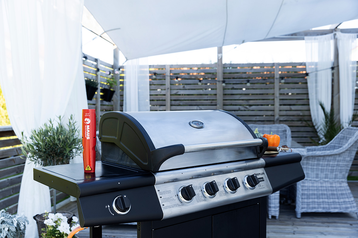 MAUS Xtin Klein beside a gas barbecue