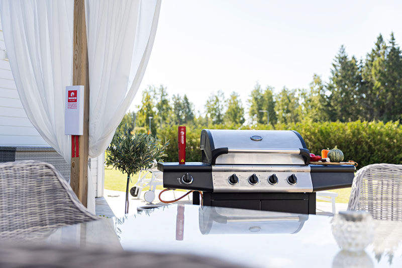 MAUS Xtin Klein next to a charcoal grill